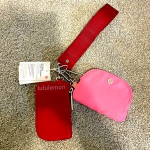 New with tags lululemon dual pouch wristlet in red and pink